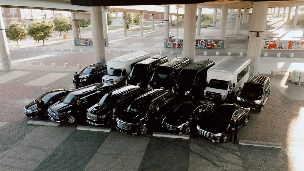ExclusiveKC full luxury fleet lineup with professional chauffeurs — Kansas City's premier black-car and limo service